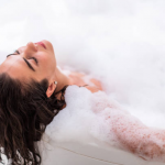 Bathtub with bubbles being drained - Tips for eliminating bathtub bubbles for a peaceful soak